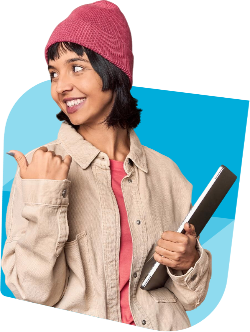 Hispanic woman wearing a denim jacket and beanie hat carrying laptop